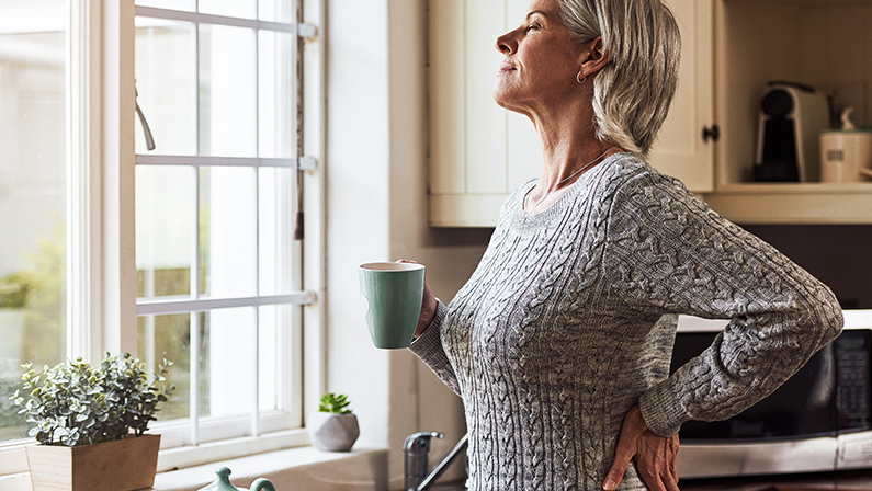 Already feeling better. Cropped shot of a relaxed senior woman preparing a cup of tea with CBD oil inside of it at home during the day.