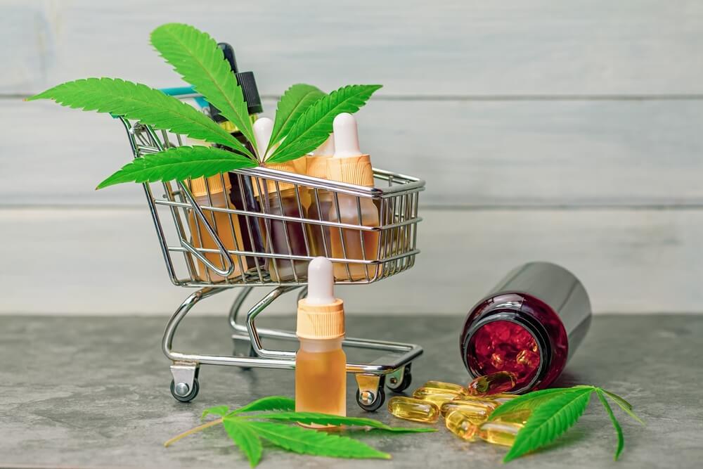Supermarket trolley basket with cannabis Cbd or THC oils capsules