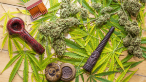 Glass smoking pipes, marijuana leaves (cannabis), hemp for illegal smoking