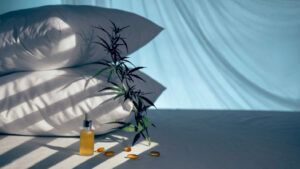 Evening bedroom with cbd oil, capsules and a cannabis branch. Melatonin production, a concept to combat sleep disorders